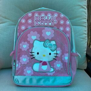 Hello kitty pink back pack.very cute and in good condition. Zip front pocket .